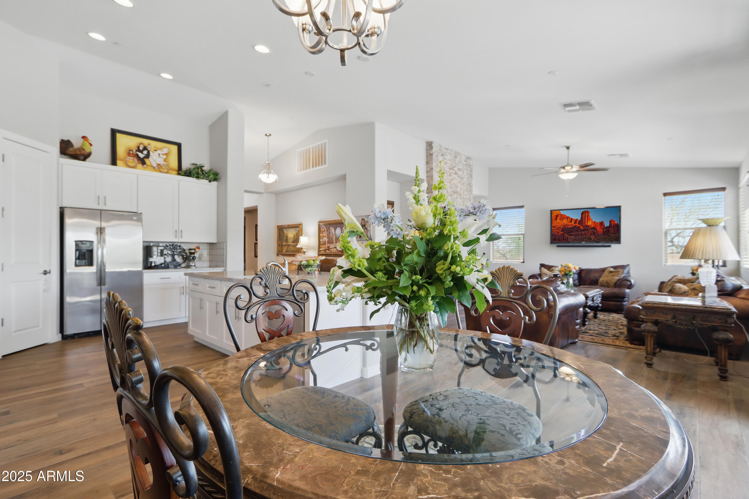 19023 East Buckskin Drive Rio Verde, AZ 85263 - Photo 11 of 58 a view of a dining room and livingroom with furniture wooden floor a chandelier
