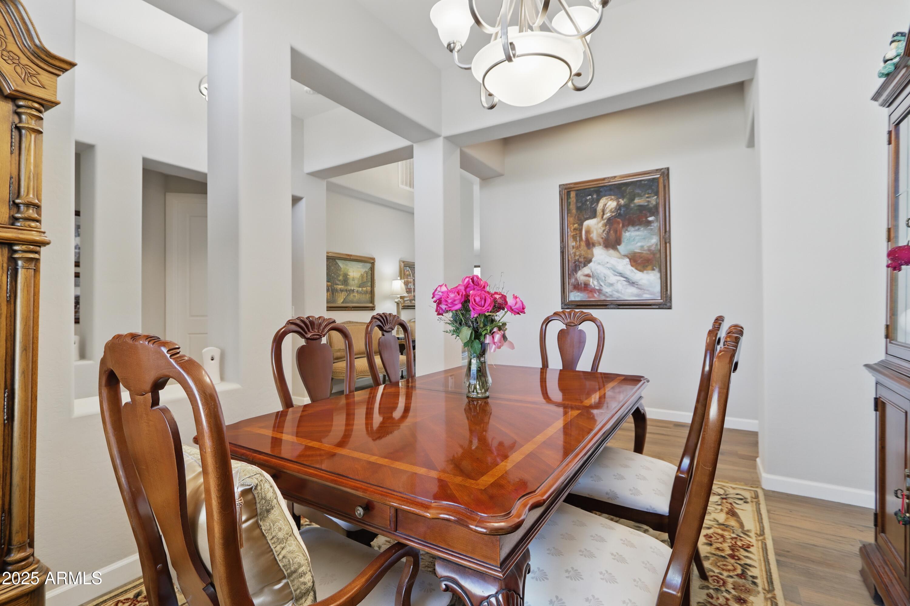 19023 East Buckskin Drive Rio Verde, AZ 85263 - Photo 21 of 58 a dining room with furniture and chandelier