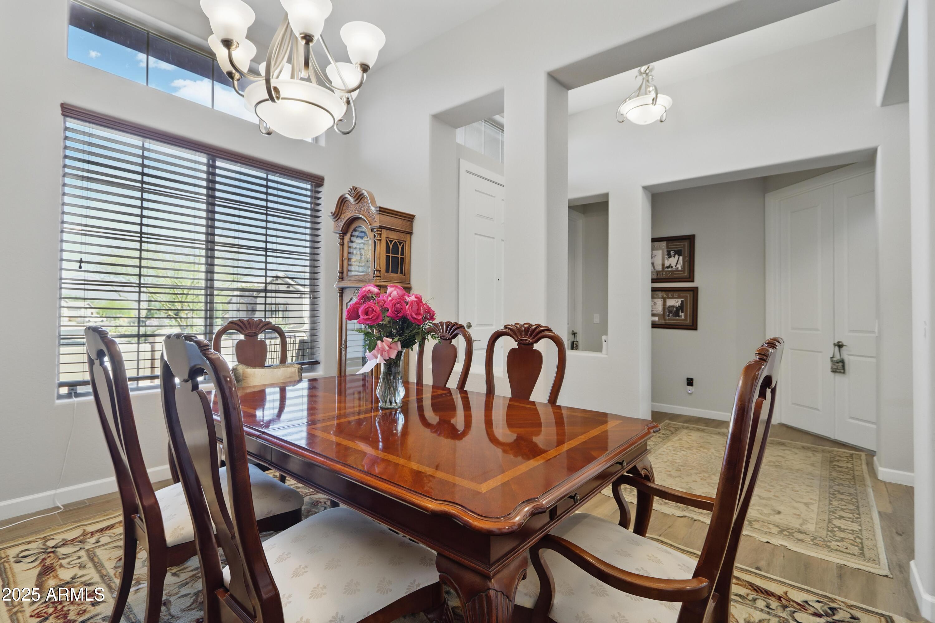 19023 East Buckskin Drive Rio Verde, AZ 85263 - Photo 22 of 58 a view of a dining room with furniture window and wooden floor
