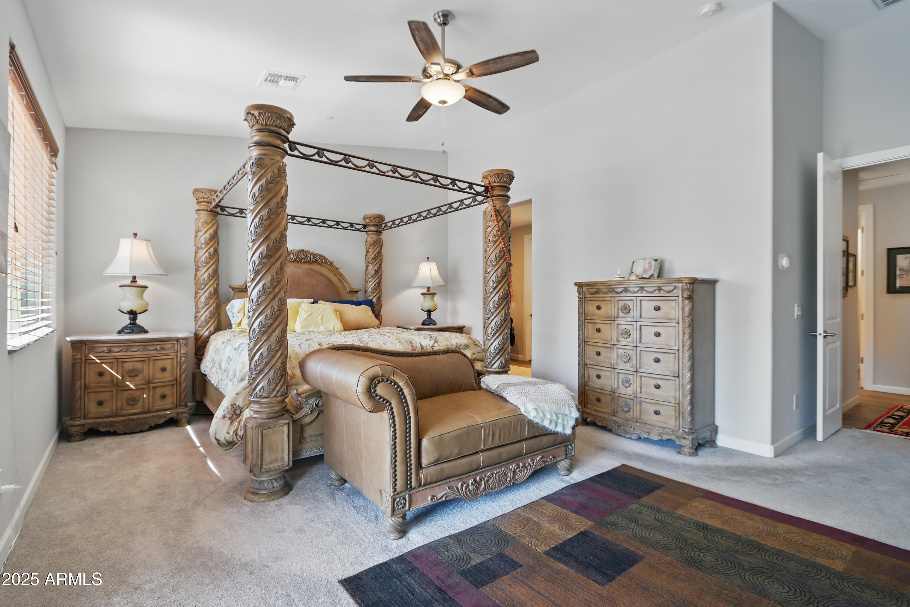 19023 East Buckskin Drive Rio Verde, AZ 85263 - Photo 24 of 58 a bedroom with furniture and a chandelier