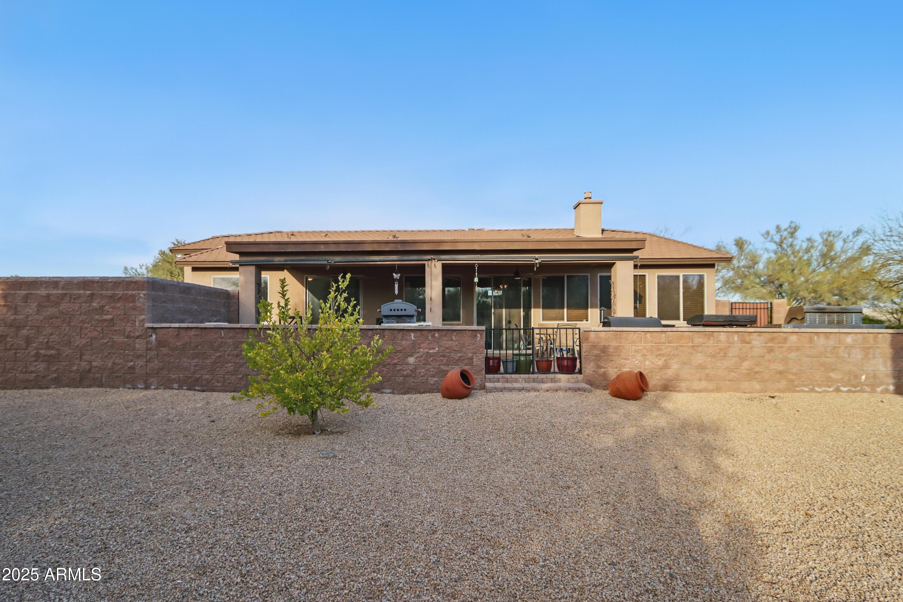 19023 East Buckskin Drive Rio Verde, AZ 85263 - Photo 24 of 31 front view of a house with a yard