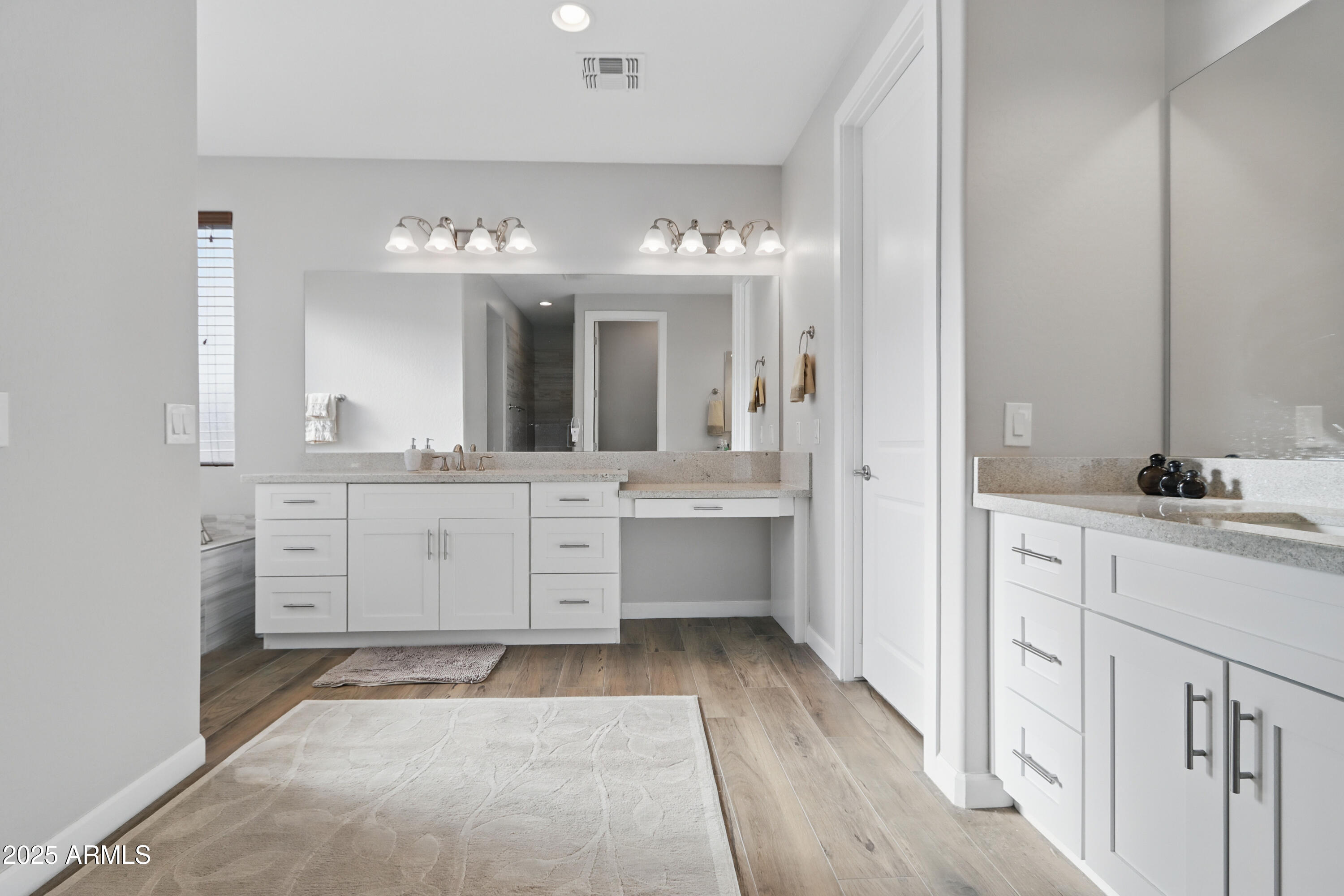 19023 East Buckskin Drive Rio Verde, AZ 85263 - Photo 27 of 58 a bathroom with a double vanity sink a mirror and a bathtub