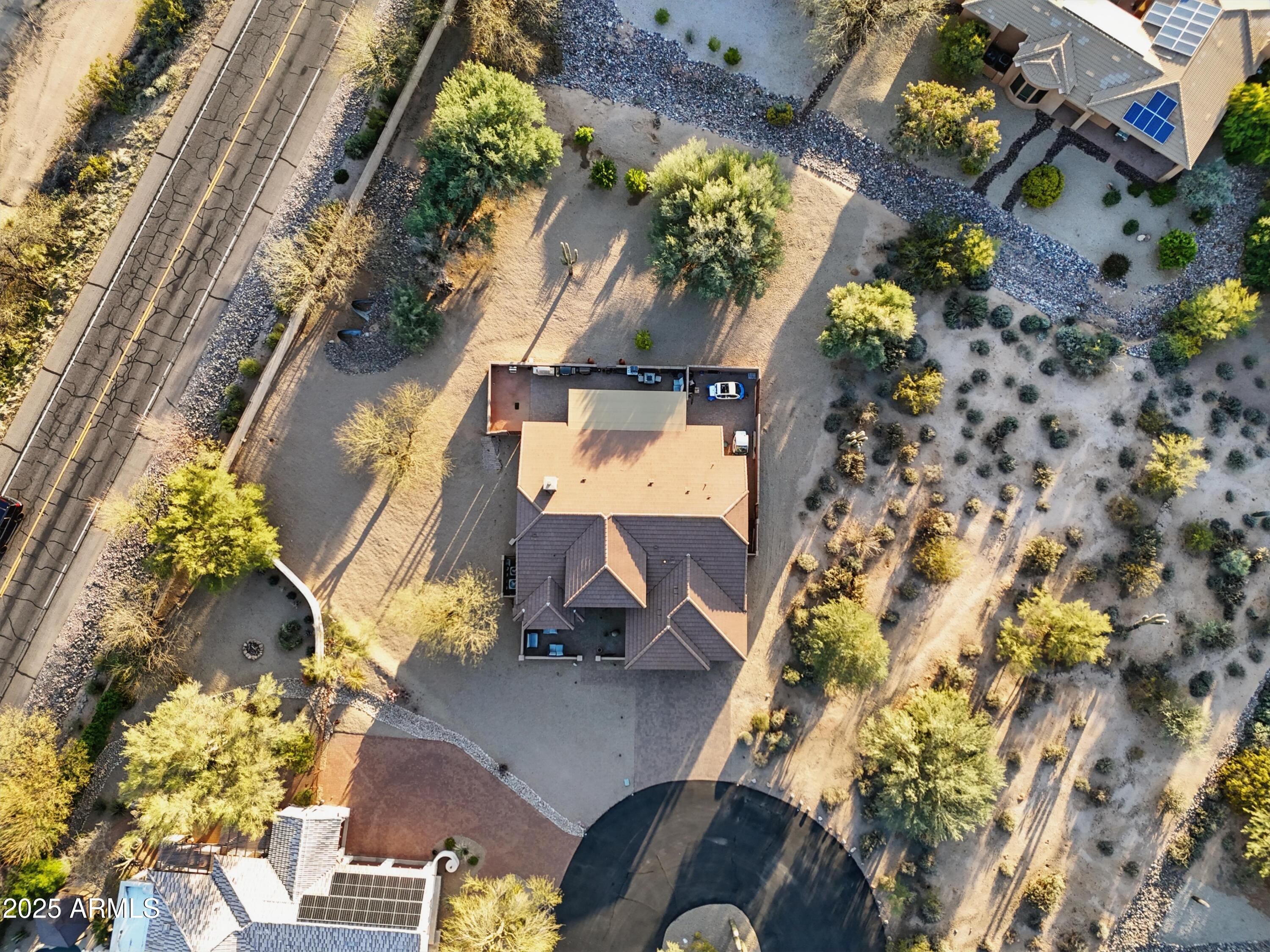 19023 East Buckskin Drive Rio Verde, AZ 85263 - Photo 57 of 58 an aerial view of a house with a yard and a large tree