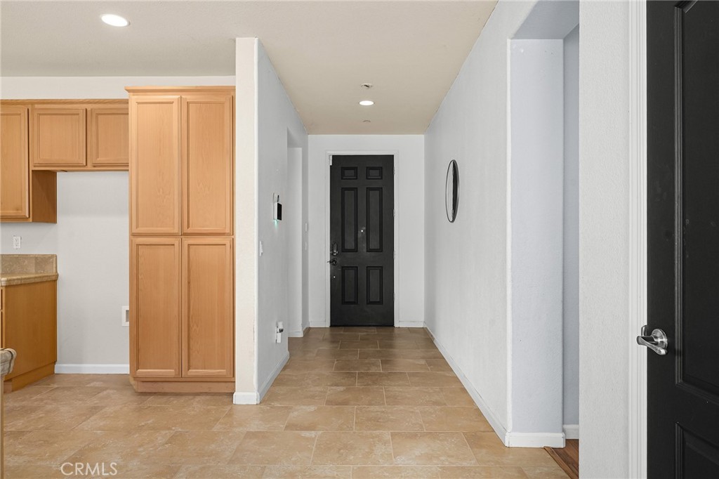 2135 Jacob Street Gridley, CA 95948 - Photo 15 of 50 a view of a hallway with wooden shelves