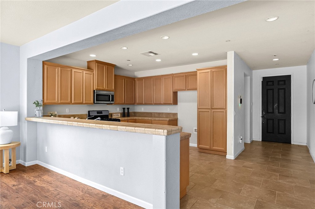 2135 Jacob Street Gridley, CA 95948 - Photo 17 of 50 a kitchen with stainless steel appliances granite countertop a refrigerator a stove a sink and a refrigerator
