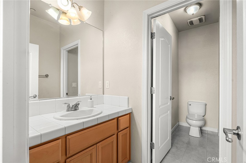 2135 Jacob Street Gridley, CA 95948 - Photo 20 of 50 a bathroom with a sink a toilet and a mirror