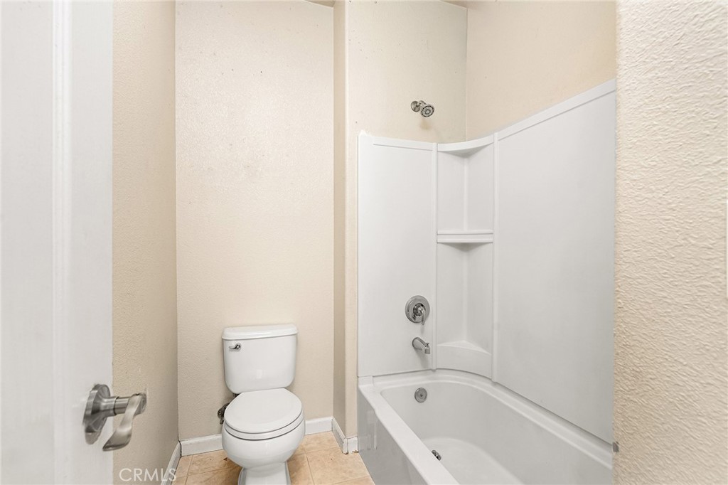 2135 Jacob Street Gridley, CA 95948 - Photo 21 of 50 a bathroom with a toilet and shower