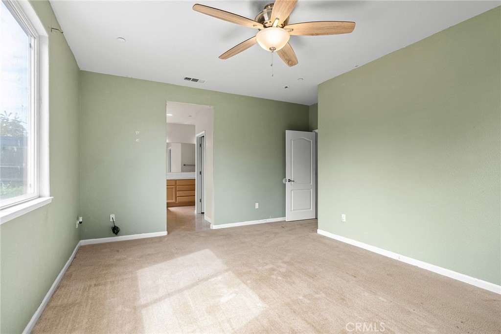 2135 Jacob Street Gridley, CA 95948 - Photo 27 of 50 an empty room with a ceiling fan and a window