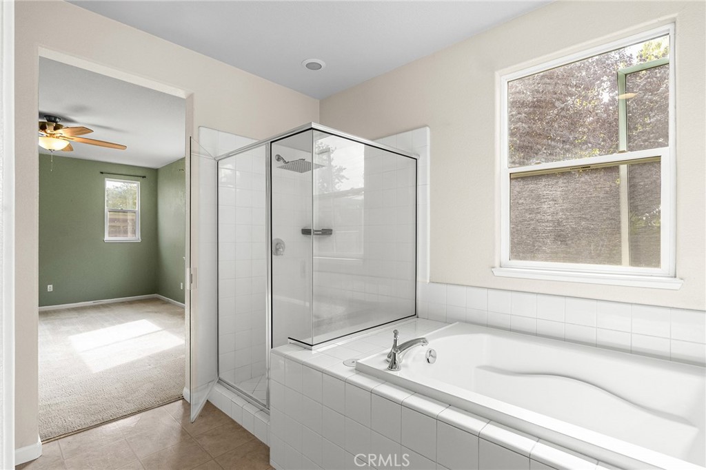 2135 Jacob Street Gridley, CA 95948 - Photo 28 of 50 a bathroom with a tub a sink and a shower