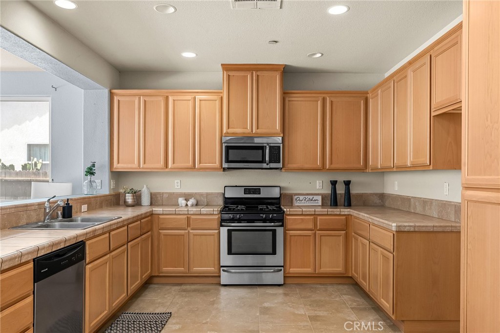 2135 Jacob Street Gridley, CA 95948 - Photo 3 of 50 a kitchen with a sink stove top oven and cabinets