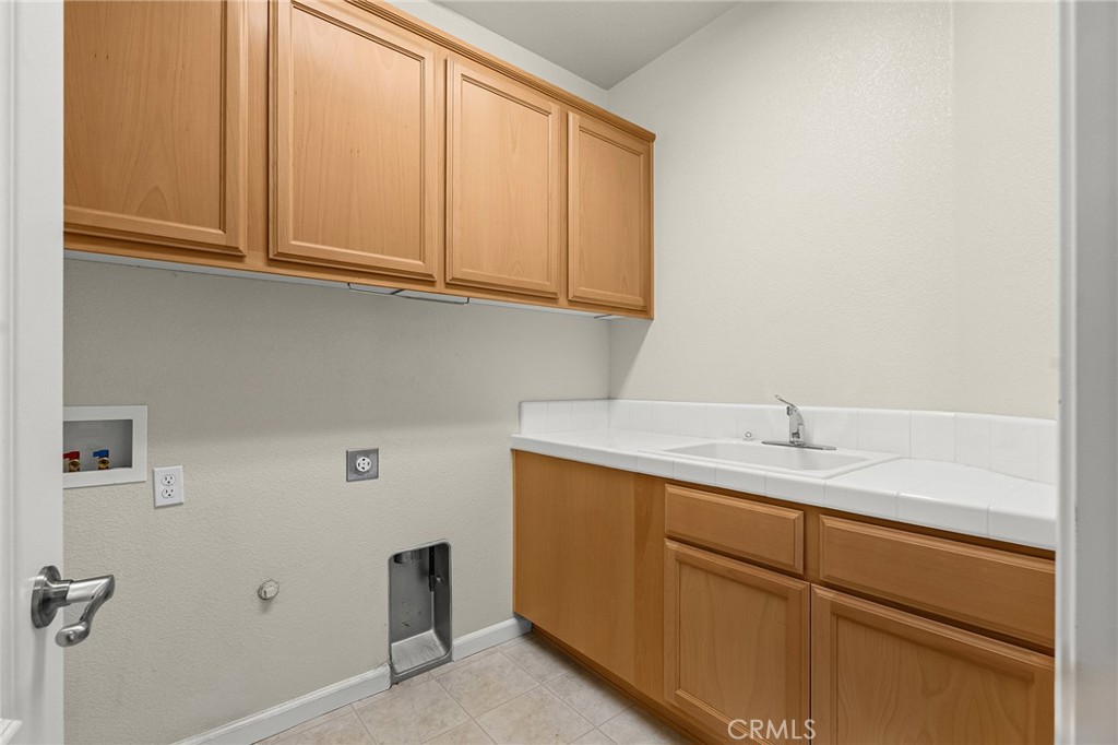 2135 Jacob Street Gridley, CA 95948 - Photo 37 of 50 a bathroom with a sink and cabinets