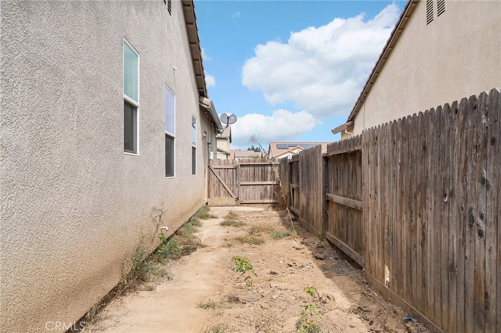 2135 Jacob Street Gridley, CA 95948 - Photo 41 of 50 a view of a pathway of a building with wooden fence