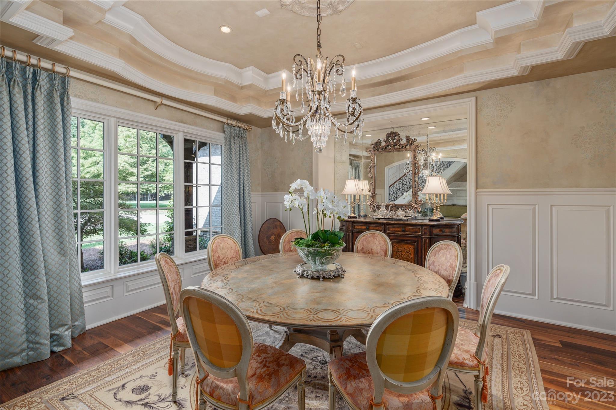 1007 Eirlys Lane Matthews, NC 28104 - Photo 11 of 48 a view of a dining room with furniture window and wooden floor