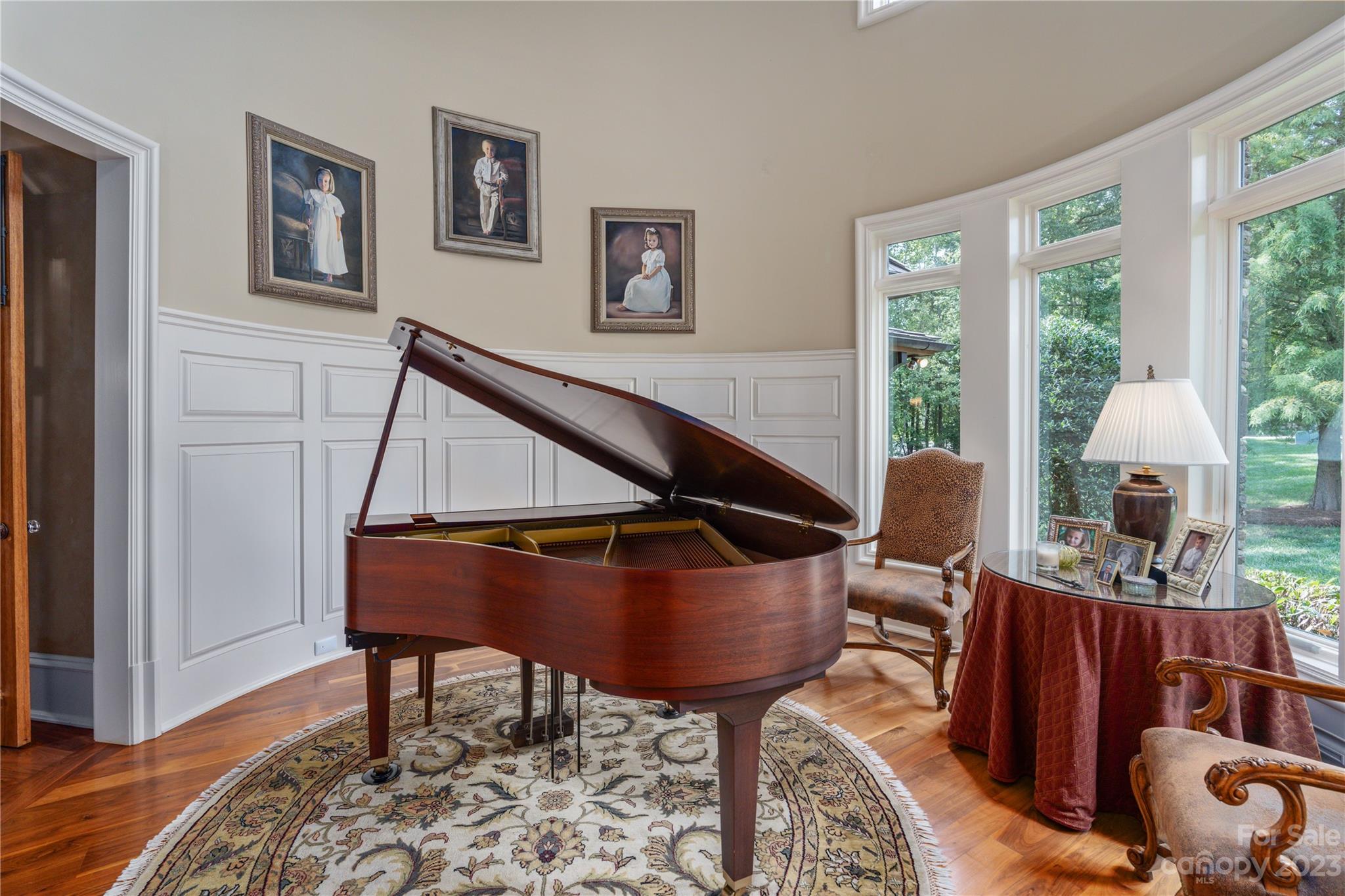 1007 Eirlys Lane Matthews, NC 28104 - Photo 13 of 48 a living room with furniture a rug and a table
