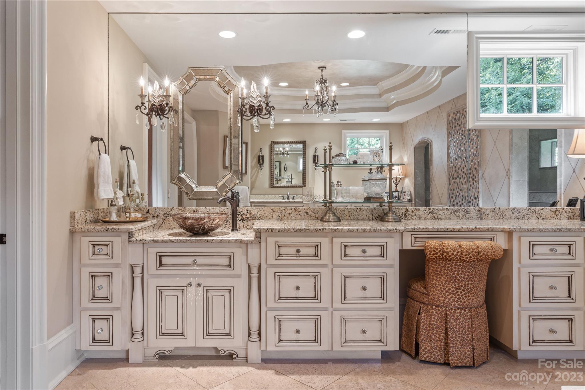 1007 Eirlys Lane Matthews, NC 28104 - Photo 18 of 48 a large kitchen with cabinets and chandelier