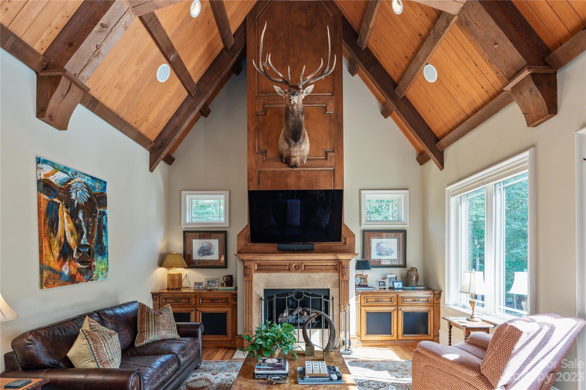 1007 Eirlys Lane Matthews, NC 28104 - Photo 22 of 48 a living room with furniture a fireplace and a flat screen tv