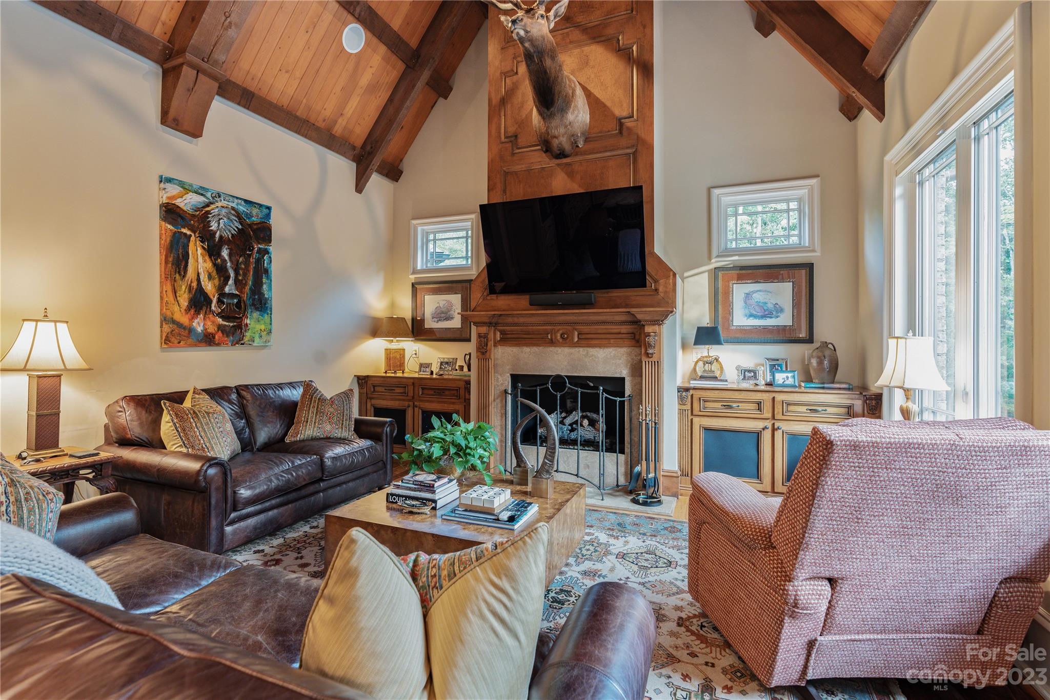 1007 Eirlys Lane Matthews, NC 28104 - Photo 23 of 48 a living room with furniture a flat screen tv and a fireplace
