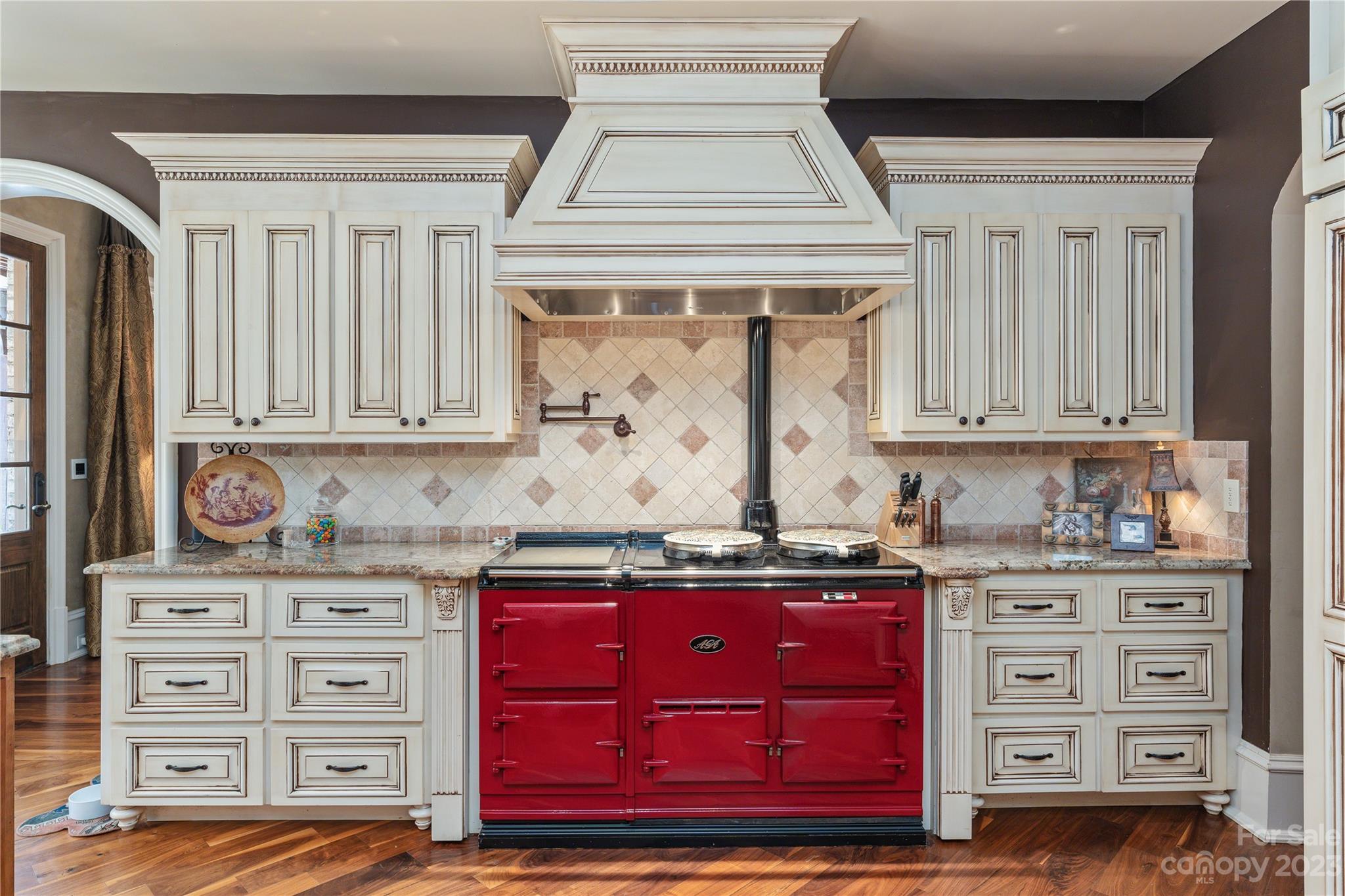 1007 Eirlys Lane Matthews, NC 28104 - Photo 26 of 48 a kitchen with stainless steel appliances granite countertop a sink and cabinets