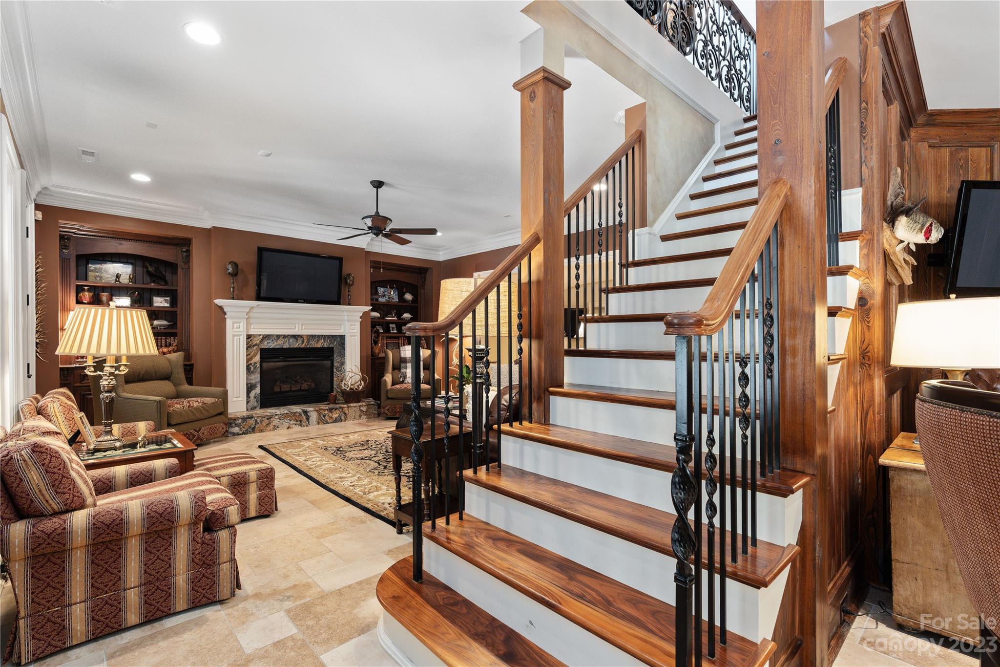 1007 Eirlys Lane Matthews, NC 28104 - Photo 39 of 48 a living room with furniture a fireplace and a flat screen tv