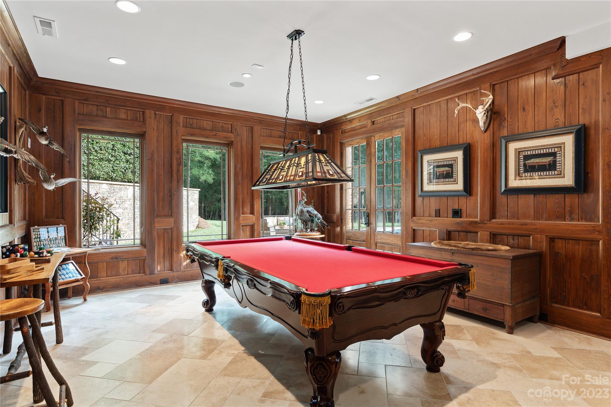 1007 Eirlys Lane Matthews, NC 28104 - Photo 42 of 48 a living room with a pool table and a flat screen tv