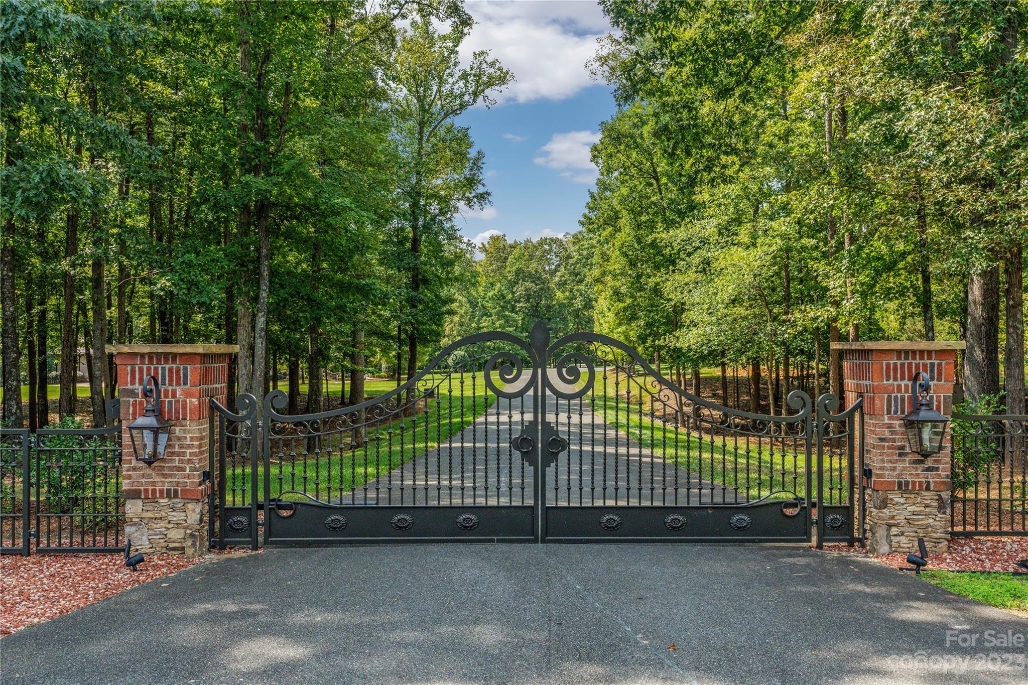 1007 Eirlys Lane Matthews, NC 28104 - Photo 5 of 48 a view of a gate with iron fence