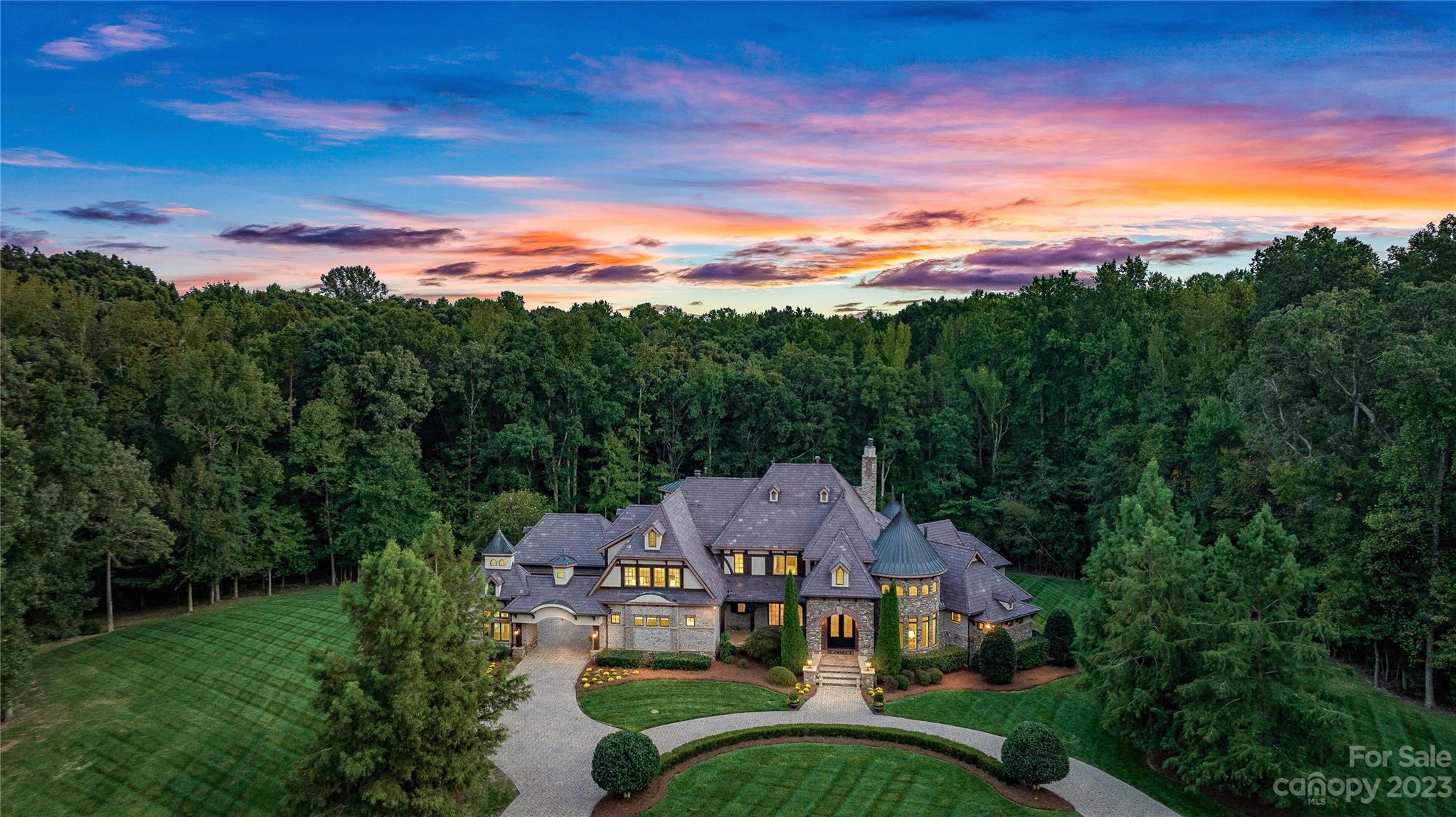 1007 Eirlys Lane Matthews, NC 28104 - Photo 6 of 48 a view of a house with a big yard couches and large trees