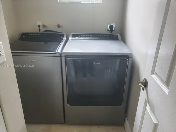 a utility room with dryer and washer