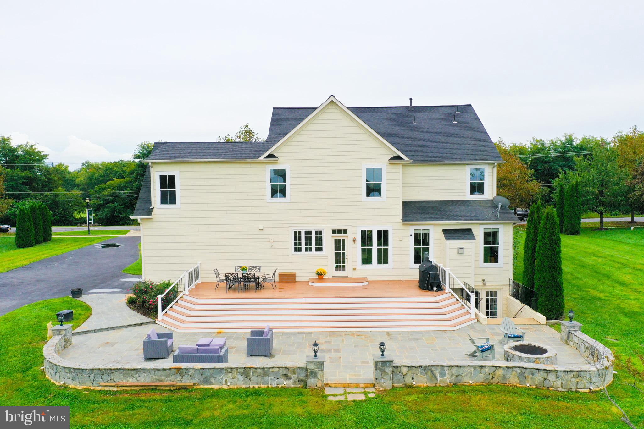 7321 Brink Road Laytonsville, MD 20882 - Photo 32 of 55 a view of a house with a yard porch and sitting area