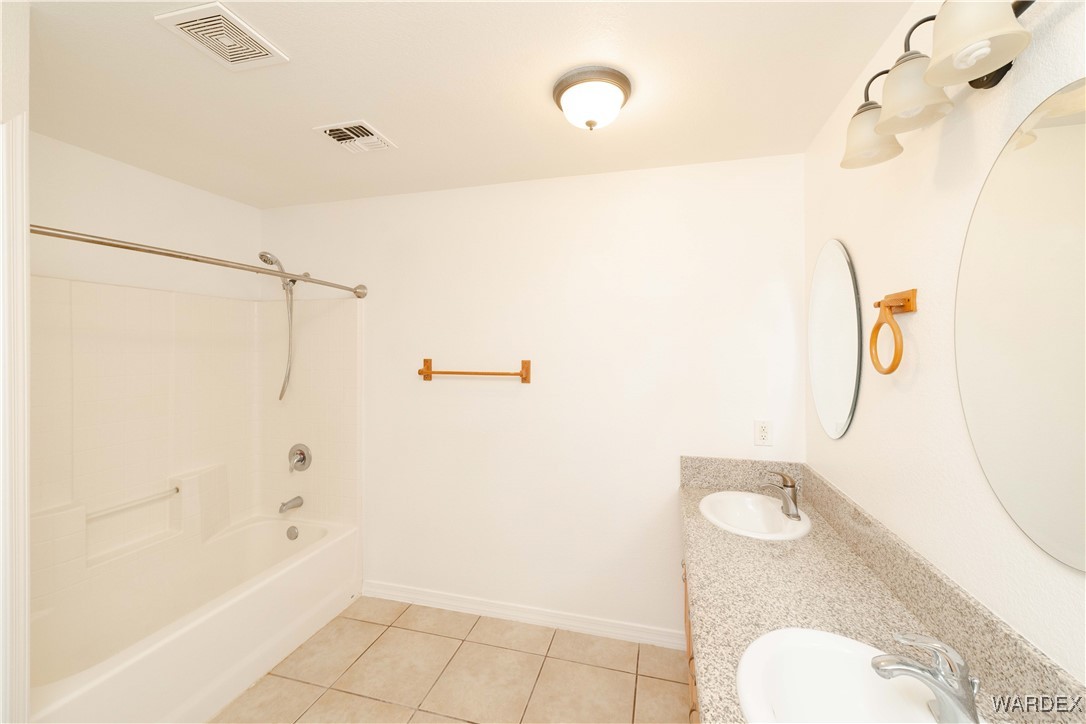 4246 Canelo Road Golden Valley, AZ 86413 - Photo 21 of 54 a bathroom with a shower and toilet