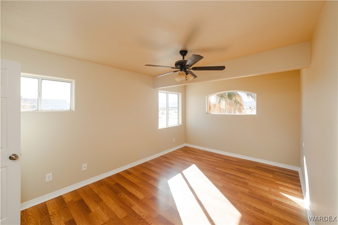 4246 Canelo Road Golden Valley, AZ 86413 - Photo 23 of 54 a view of a room with a ceiling fan and a window