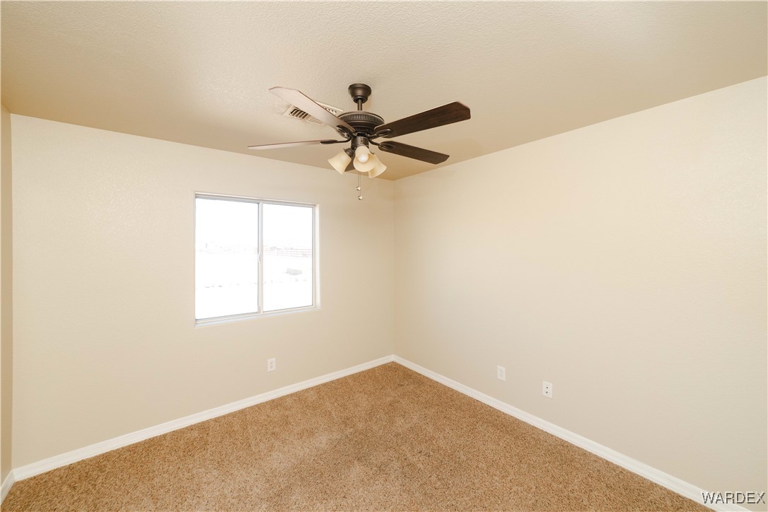 4246 Canelo Road Golden Valley, AZ 86413 - Photo 31 of 54 a view of a big room with carpet