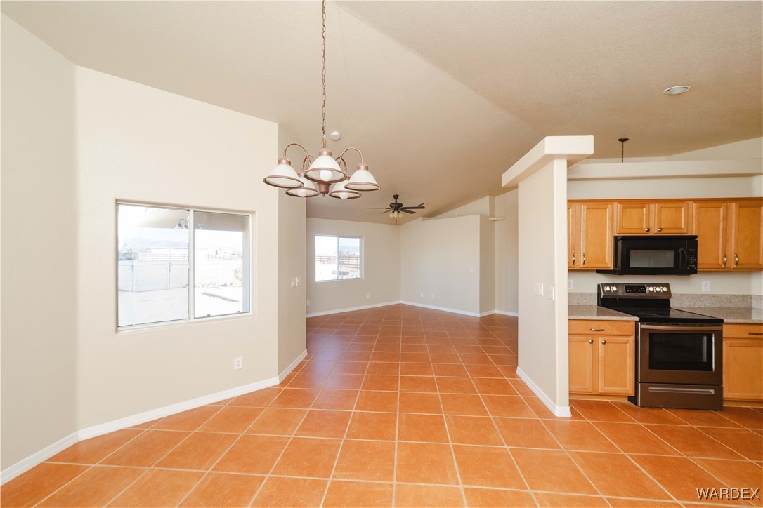 4246 Canelo Road Golden Valley, AZ 86413 - Photo 38 of 54 a view of a kitchen with a sink cabinets and a window