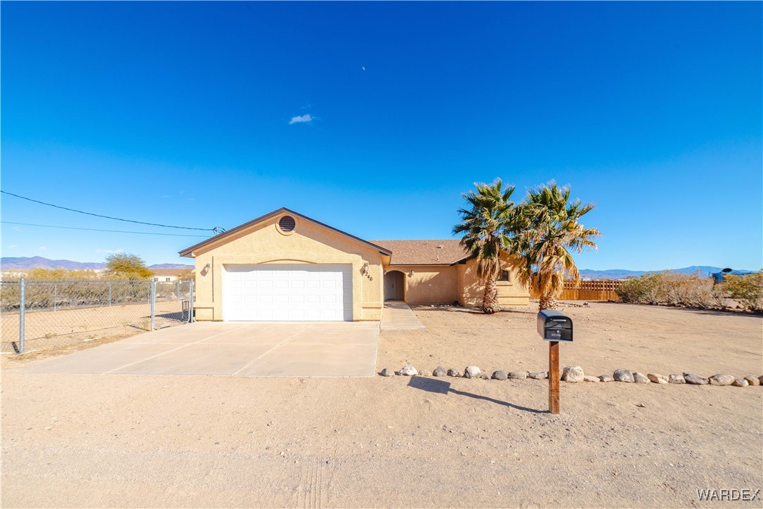 4246 Canelo Road Golden Valley, AZ 86413 - Photo 4 of 54 a view of a house with a yard