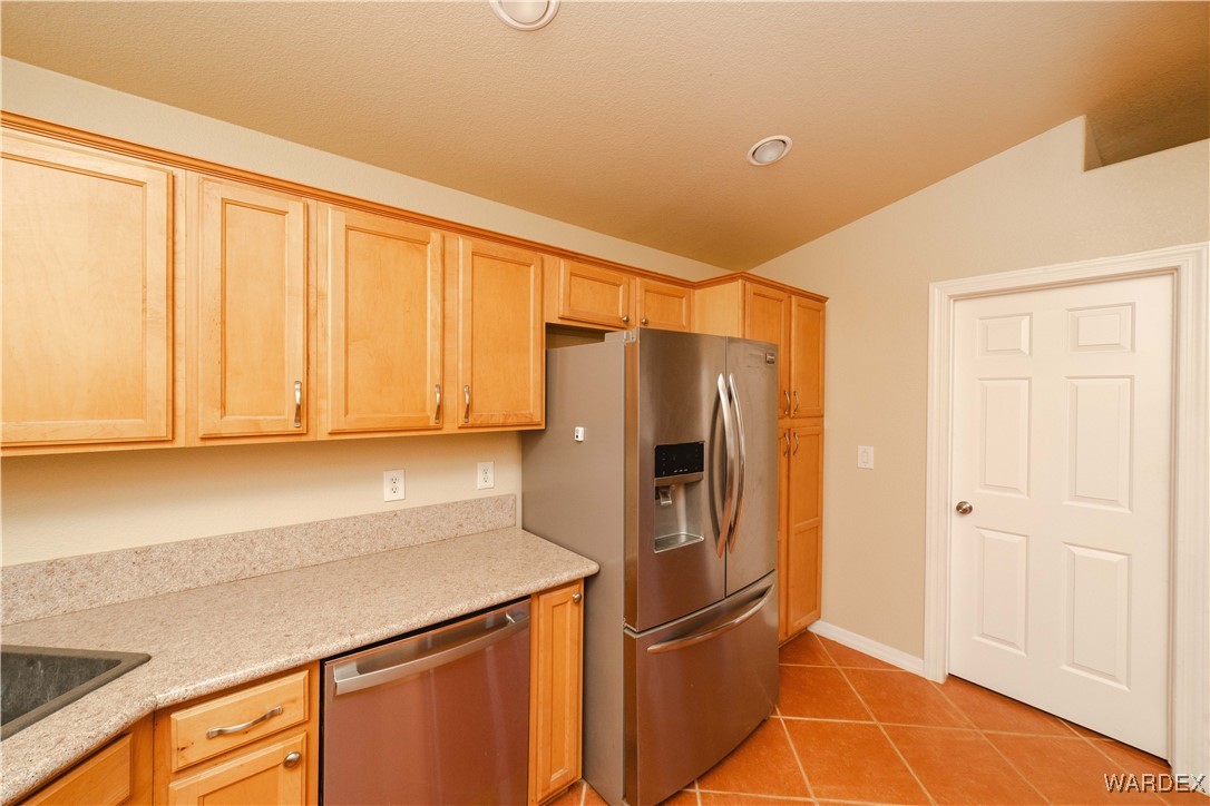 4246 Canelo Road Golden Valley, AZ 86413 - Photo 41 of 54 a kitchen with stainless steel appliances a refrigerator and cabinets
