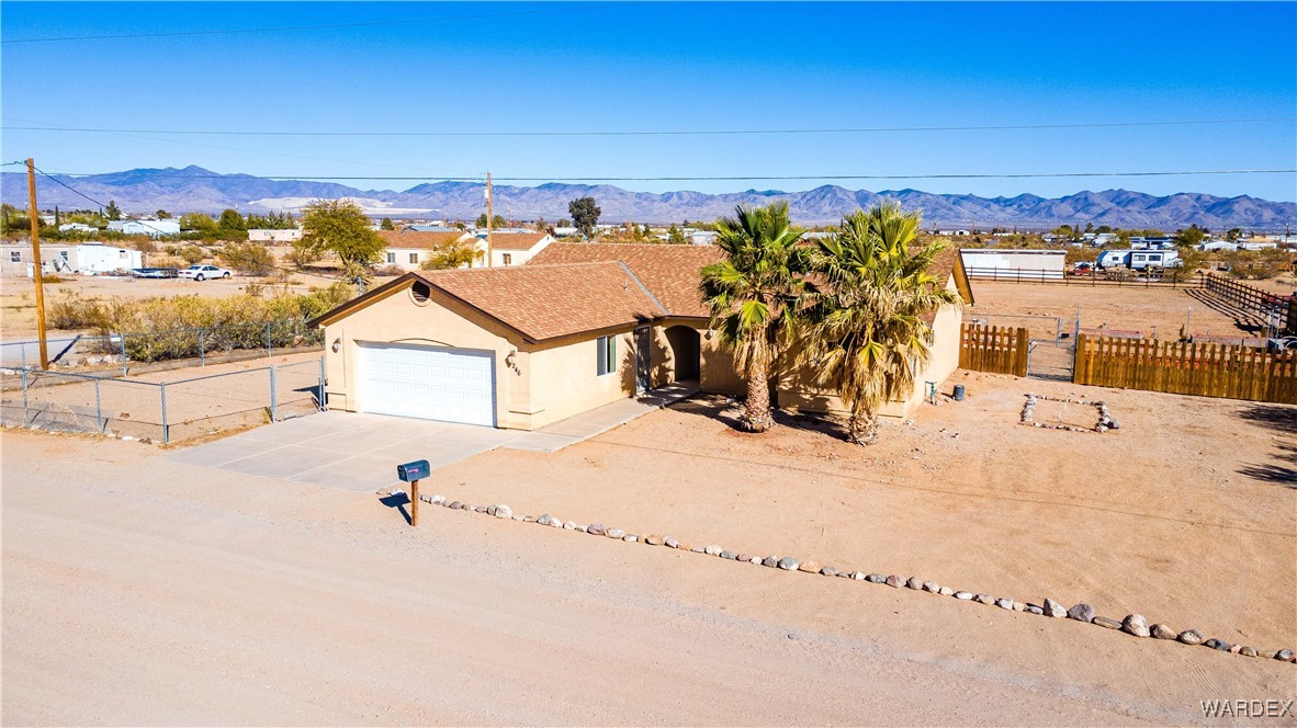 4246 Canelo Road Golden Valley, AZ 86413 - Photo 48 of 54 an aerial view of a house with a yard