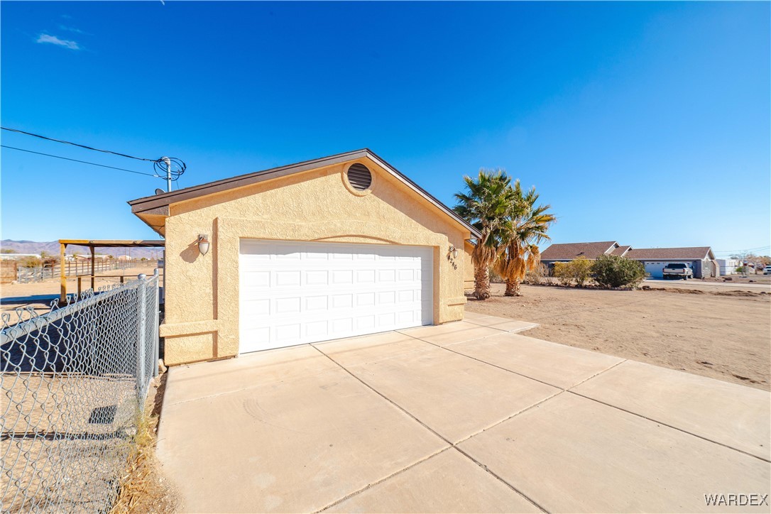 4246 Canelo Road Golden Valley, AZ 86413 - Photo 6 of 54 a front view of a house with a yard