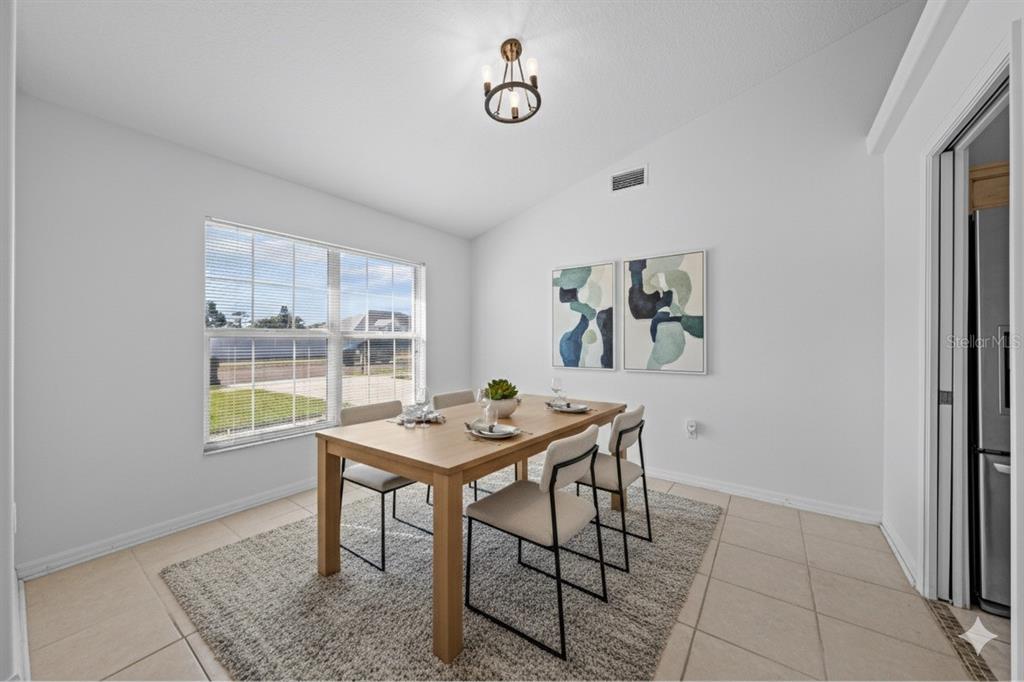 2708 Kayak Court St. Cloud, FL 34772 - Photo 3 of 56 a view of a dining room with furniture