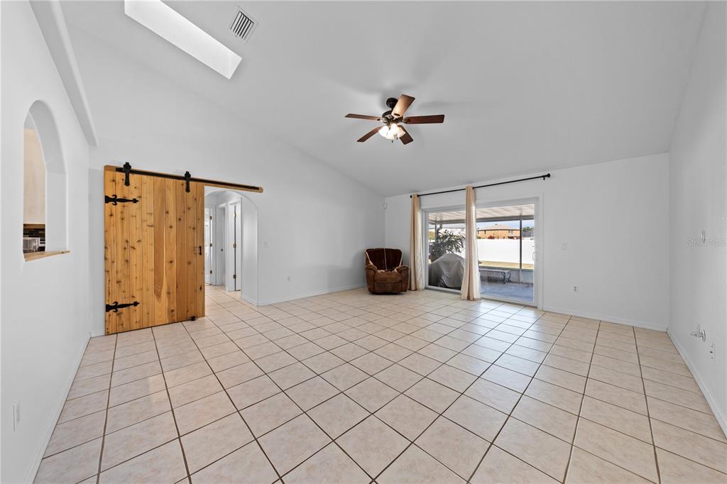 2708 Kayak Court St. Cloud, FL 34772 - Photo 31 of 56 a view of a livingroom with a chandelier fan and windows