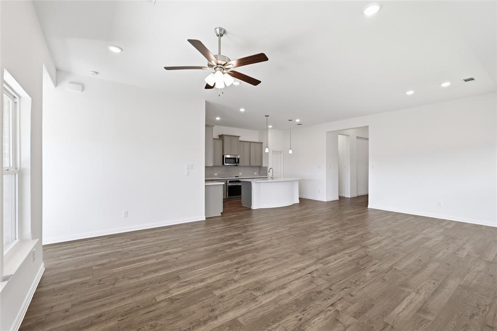 2529 Rivers W Road Anna, TX 75409 - Photo 10 of 40 Spacious interior featuring wood-finish flooring, recessed lighting, and a ceiling fan
