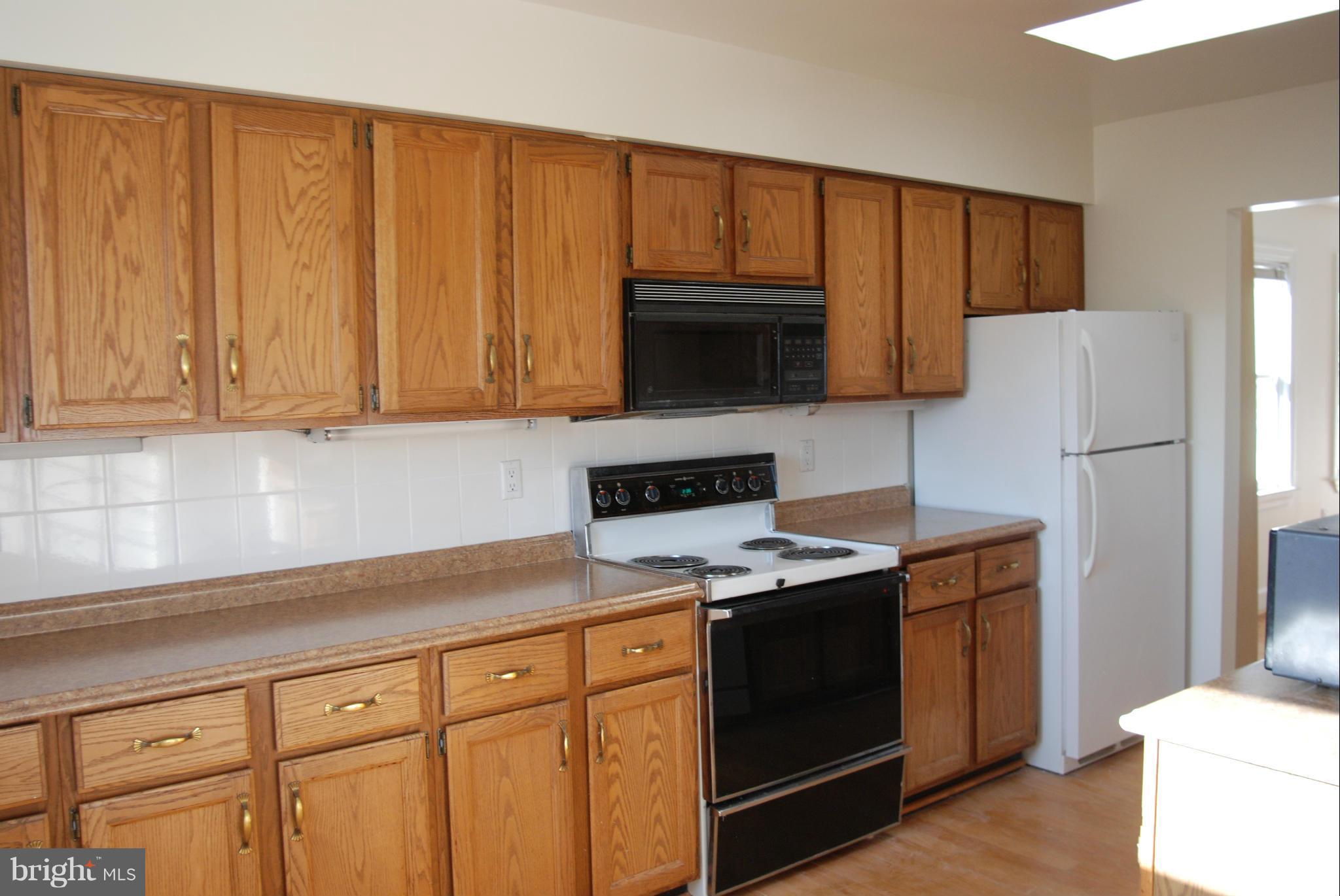 316 F Street Northeast, Unit 1 Washington, DC 20002 - Photo 2 of 18 a kitchen with stainless steel appliances granite countertop a refrigerator stove a sink and dishwasher