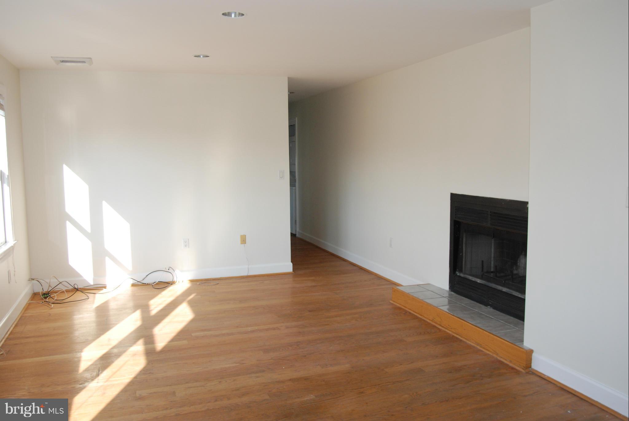 316 F Street Northeast, Unit 1 Washington, DC 20002 - Photo 4 of 18 a view of an empty room and window
