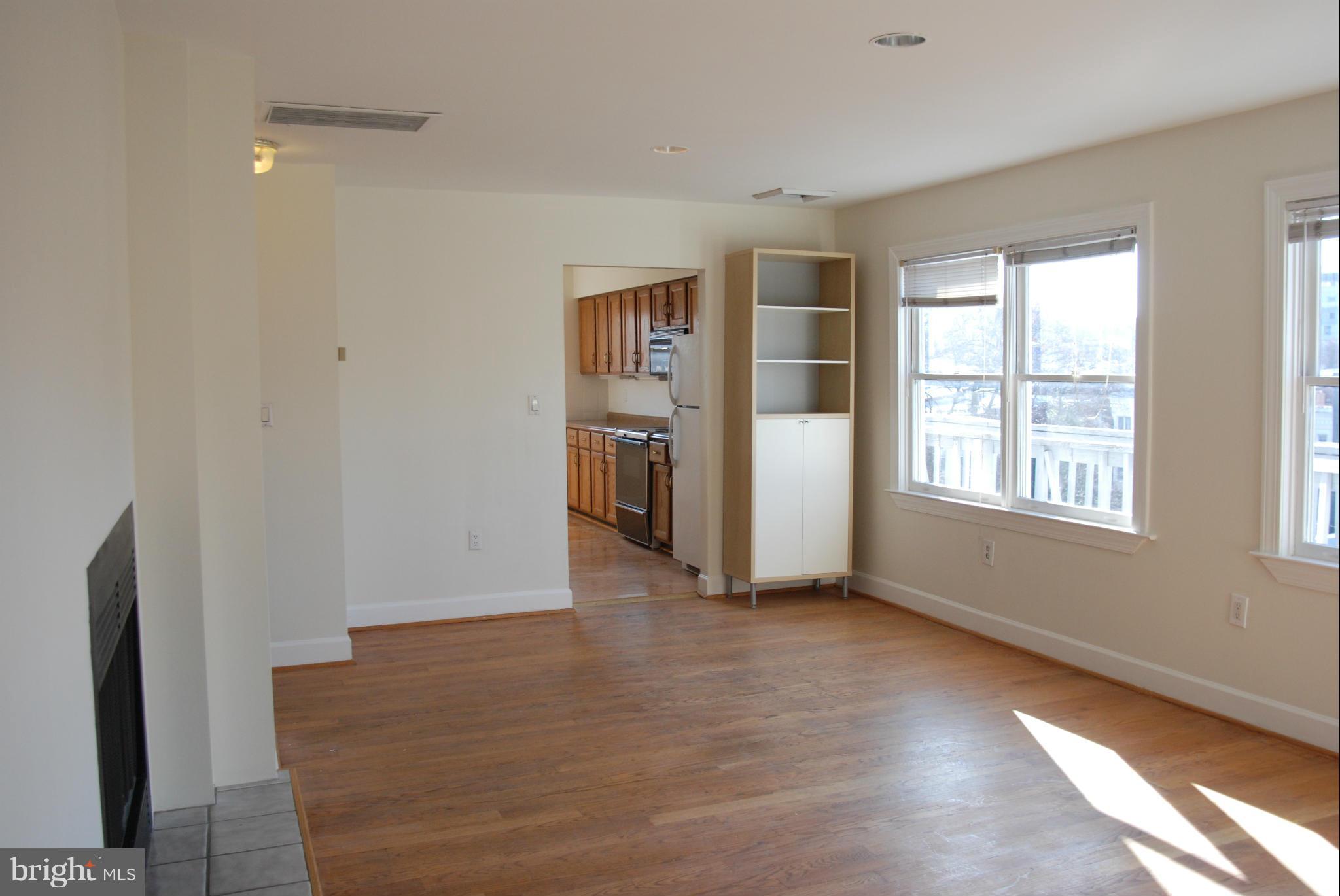 316 F Street Northeast, Unit 1 Washington, DC 20002 - Photo 5 of 18 an empty room with windows and closet