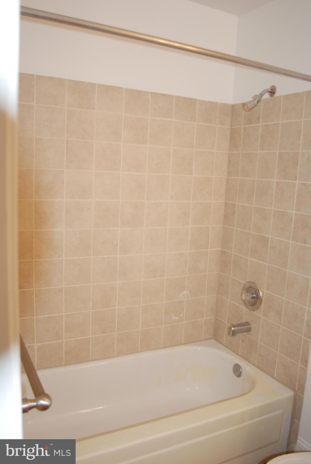 316 F Street Northeast, Unit 1 Washington, DC 20002 - Photo 10 of 18 a bathroom with a shower and a bathtub