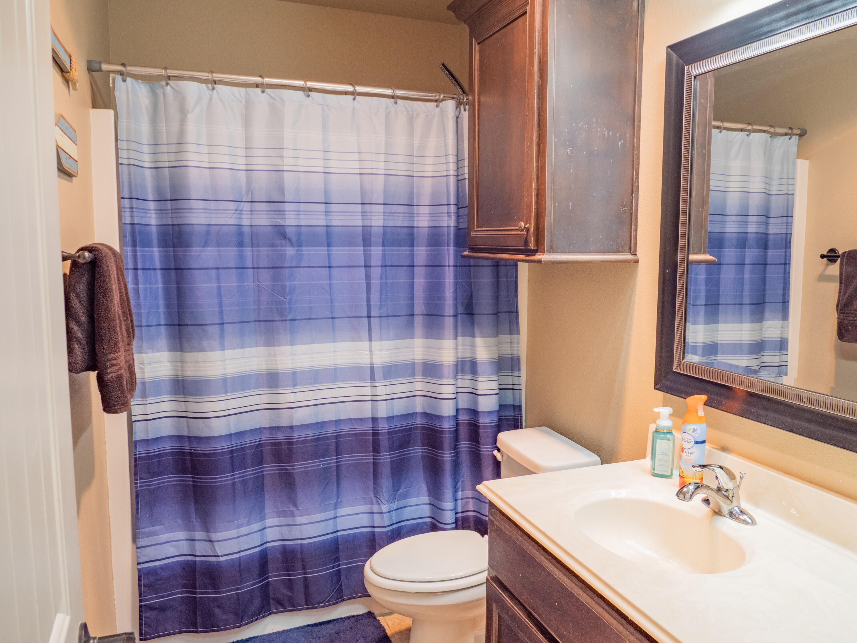 910 12th Street Wolfforth, TX 79382 - Photo 15 of 18 a bathroom with a sink a toilet and shower