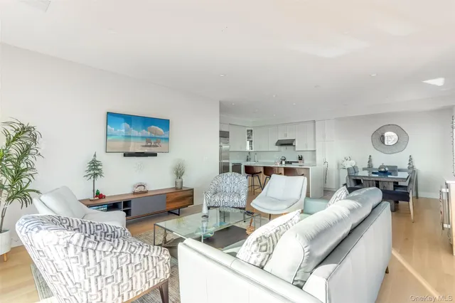 a large kitchen with a table and chairs