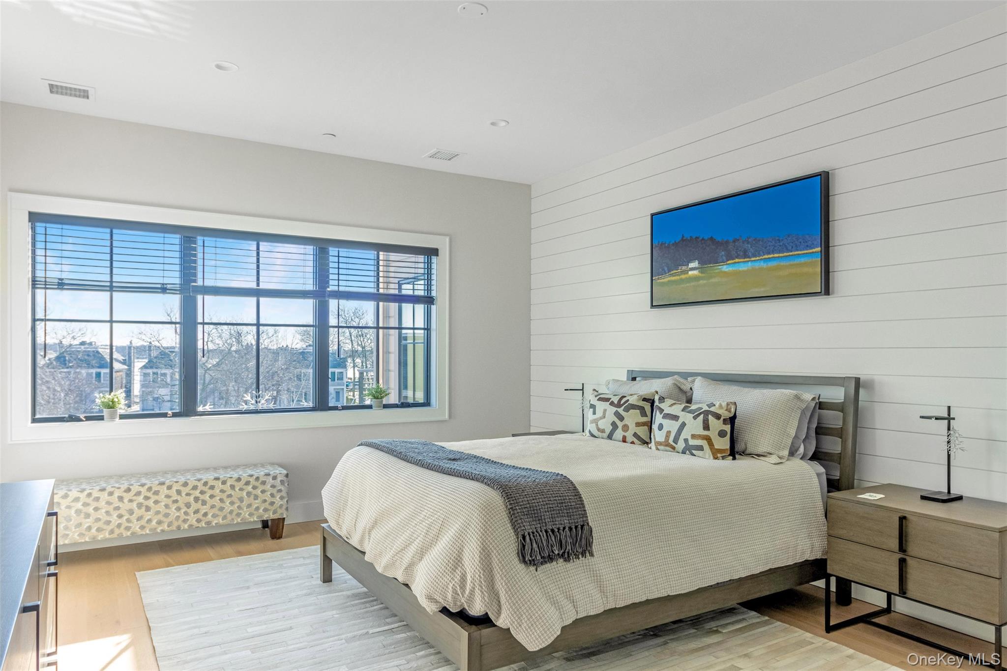 123 Sterling Avenue, Unit 12 Greenport, NY 11944 - Photo 14 of 29 a bedroom with a bed and a large window