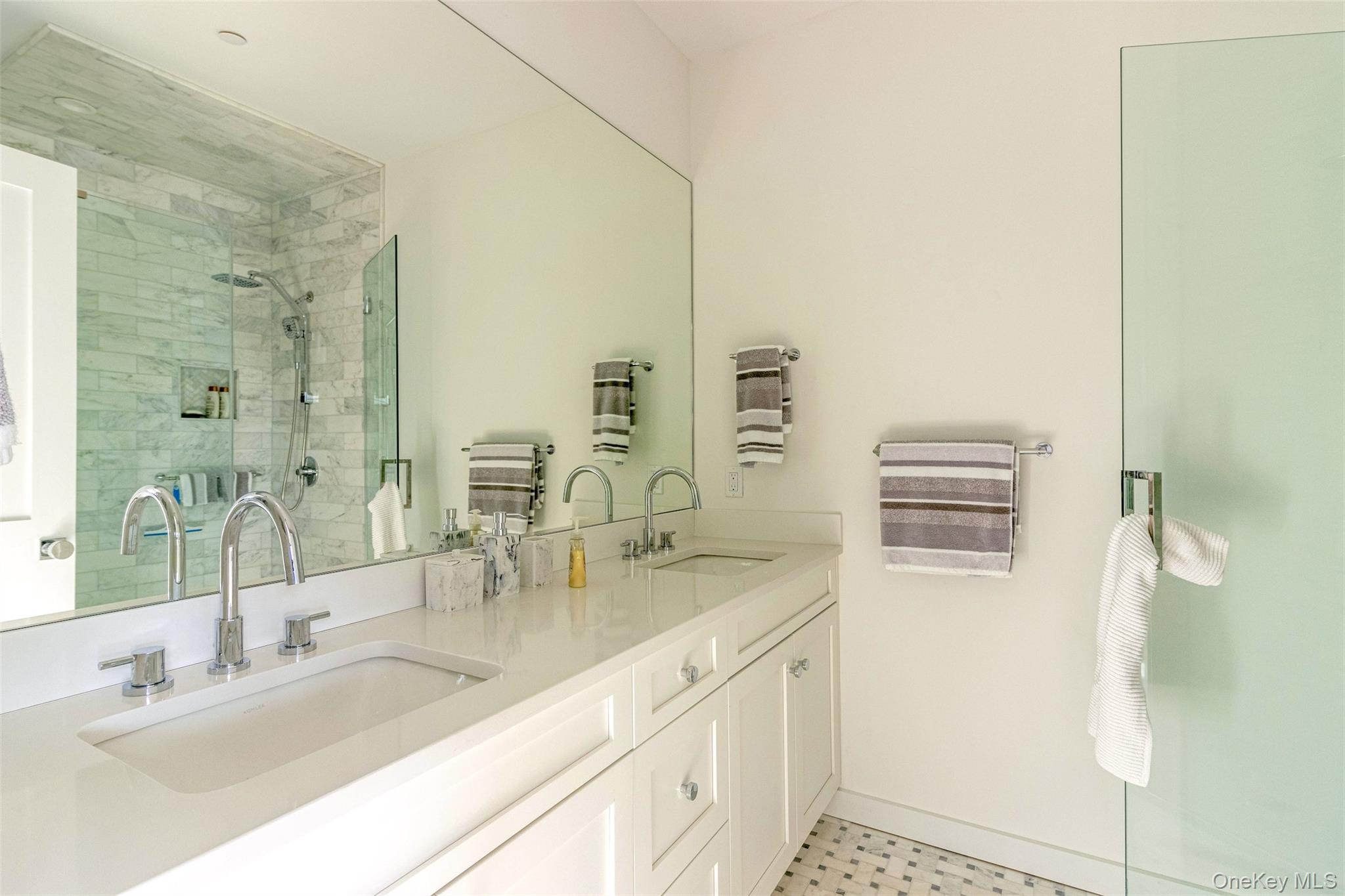 123 Sterling Avenue, Unit 12 Greenport, NY 11944 - Photo 19 of 29 a bathroom with a granite countertop sink and a mirror