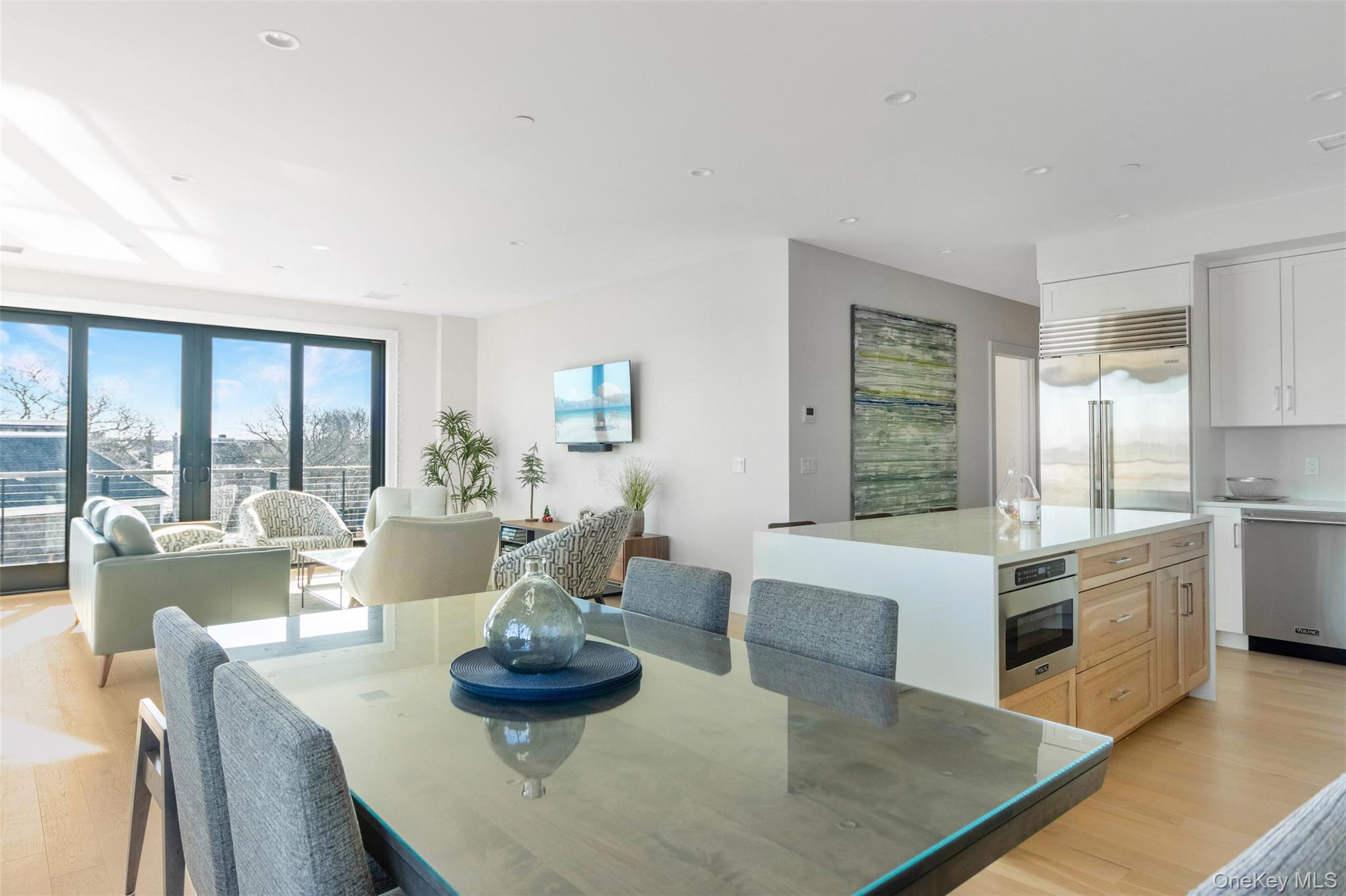 123 Sterling Avenue, Unit 12 Greenport, NY 11944 - Photo 7 of 29 a living room with fireplace furniture and a large window