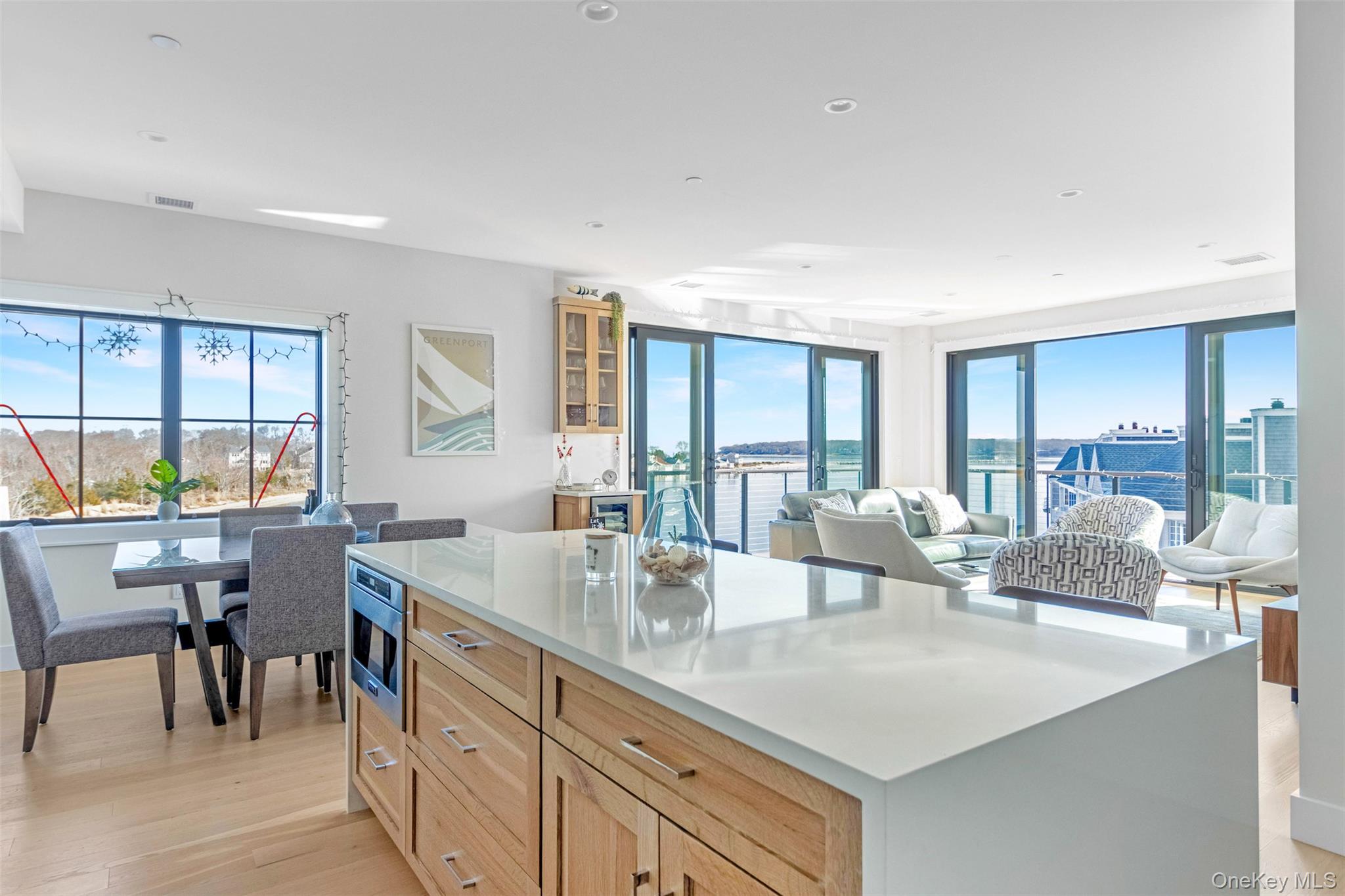 123 Sterling Avenue, Unit 12 Greenport, NY 11944 - Photo 29 of 29 a dining hall with stainless steel appliances granite countertop a dining table and chairs