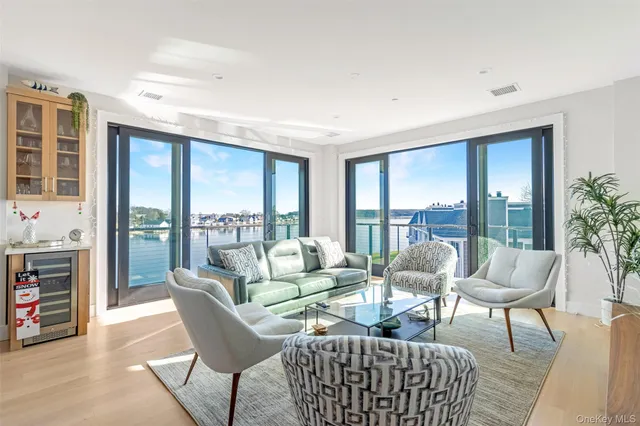 a dining hall with stainless steel appliances granite countertop a dining table and chairs